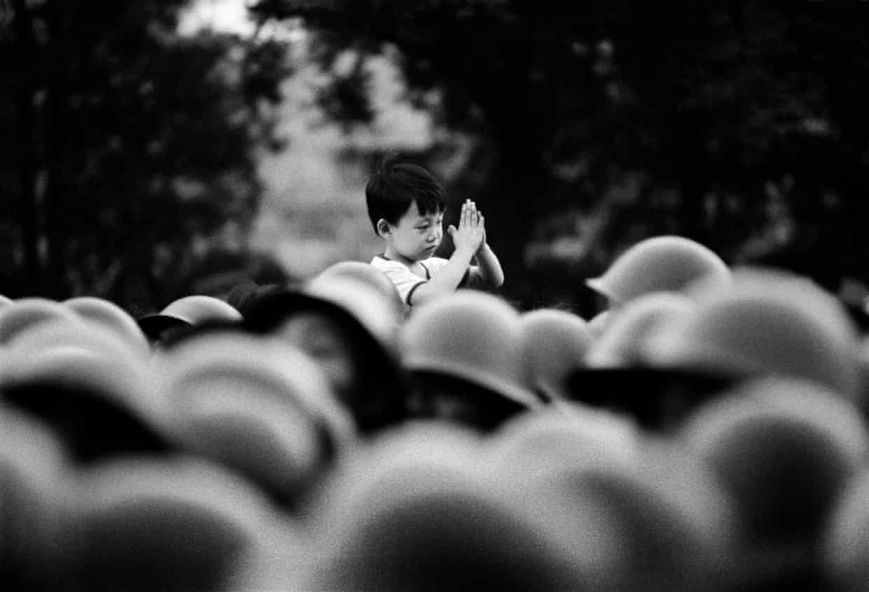 Beijing, China · 1989 — A child above the crowd
